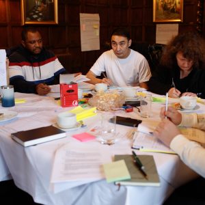 WSC staff talk about the issues on which they work around a table.